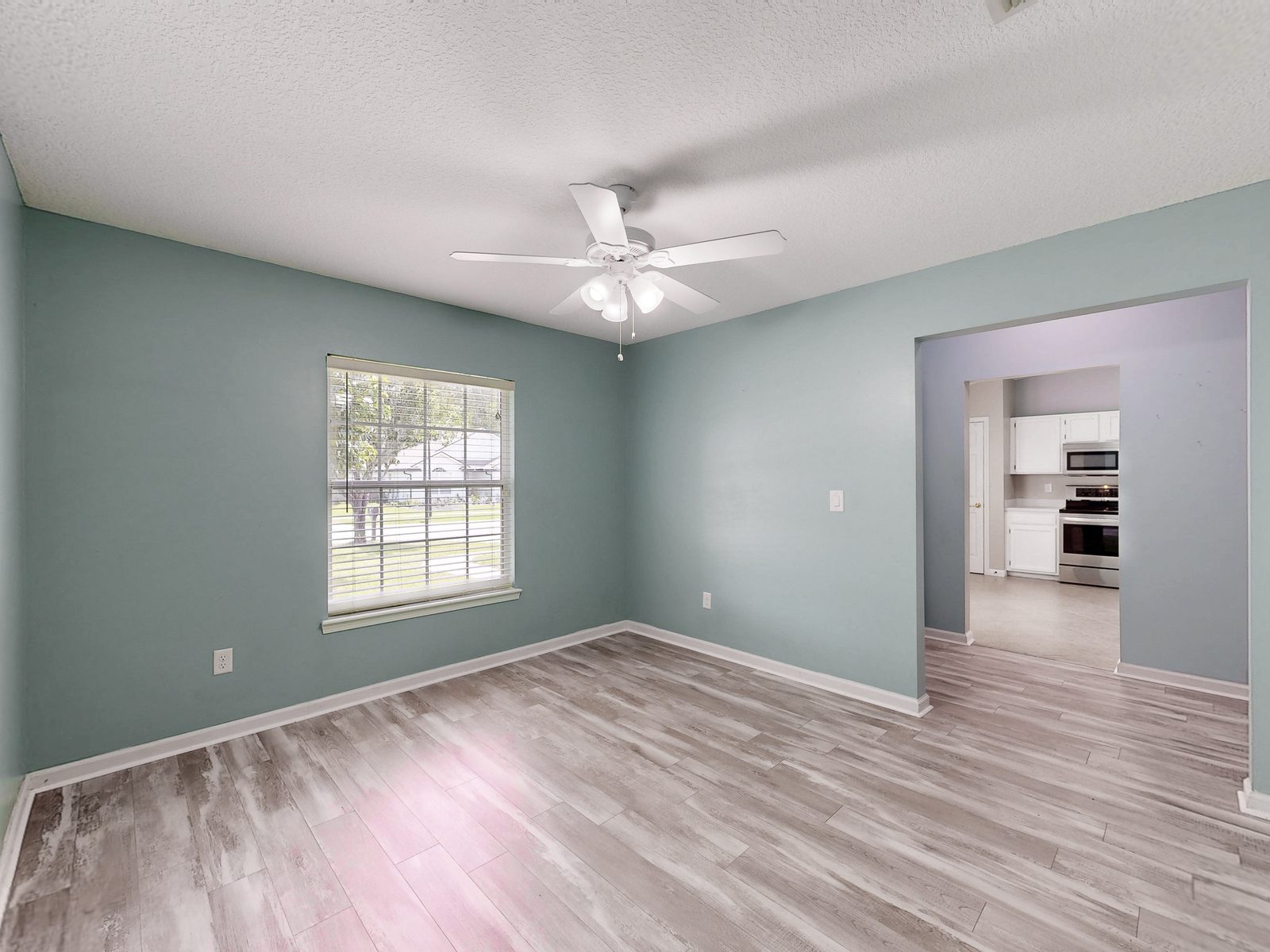 HDR still of an empty bedroom with sage green walls exported from a Matterport scan for a Jacksonville FL listing