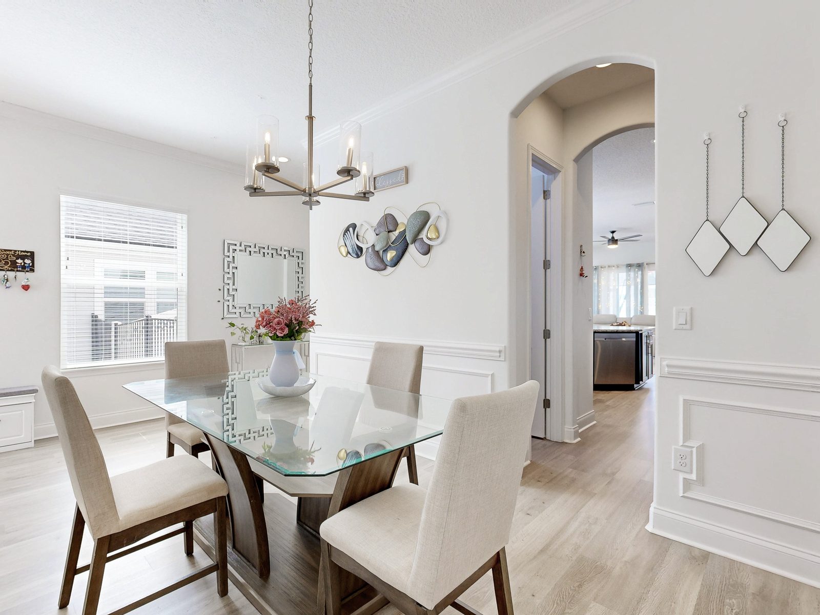 HDR still photo of a staged dining room with glass table, exported from a Matterport scan of a Jacksonville home