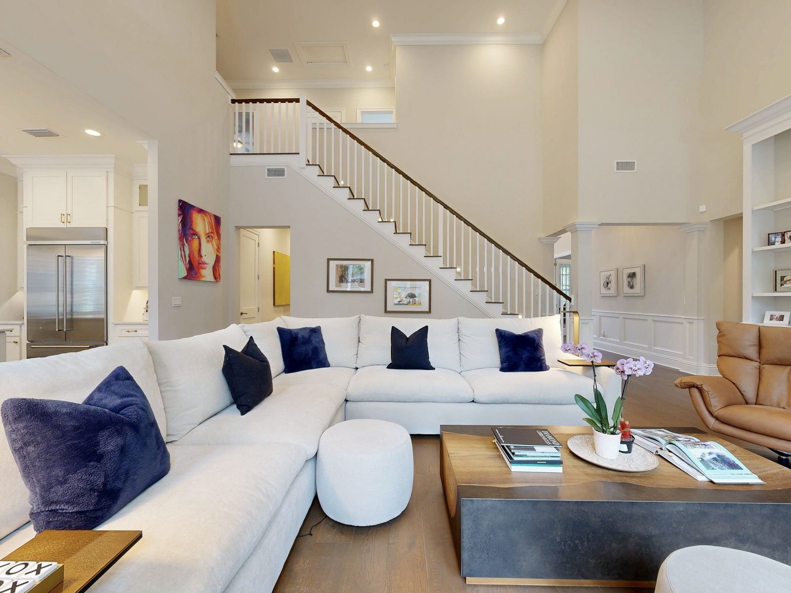 HDR still from a Matterport scan of a two-story great room with staircase in a Ponte Vedra Beach FL luxury home