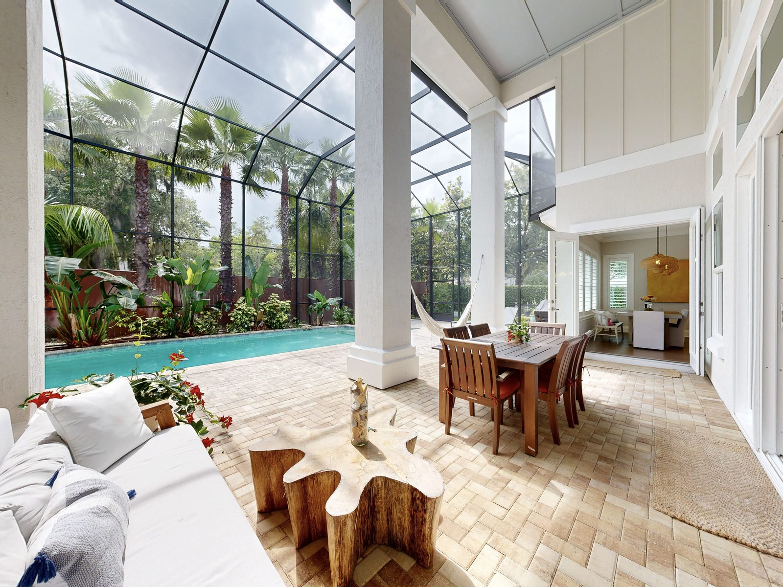 Poolside lanai with palm trees photographed from a Matterport scan with accurate outdoor colors in good daylight, Ponte Vedra Beach FL