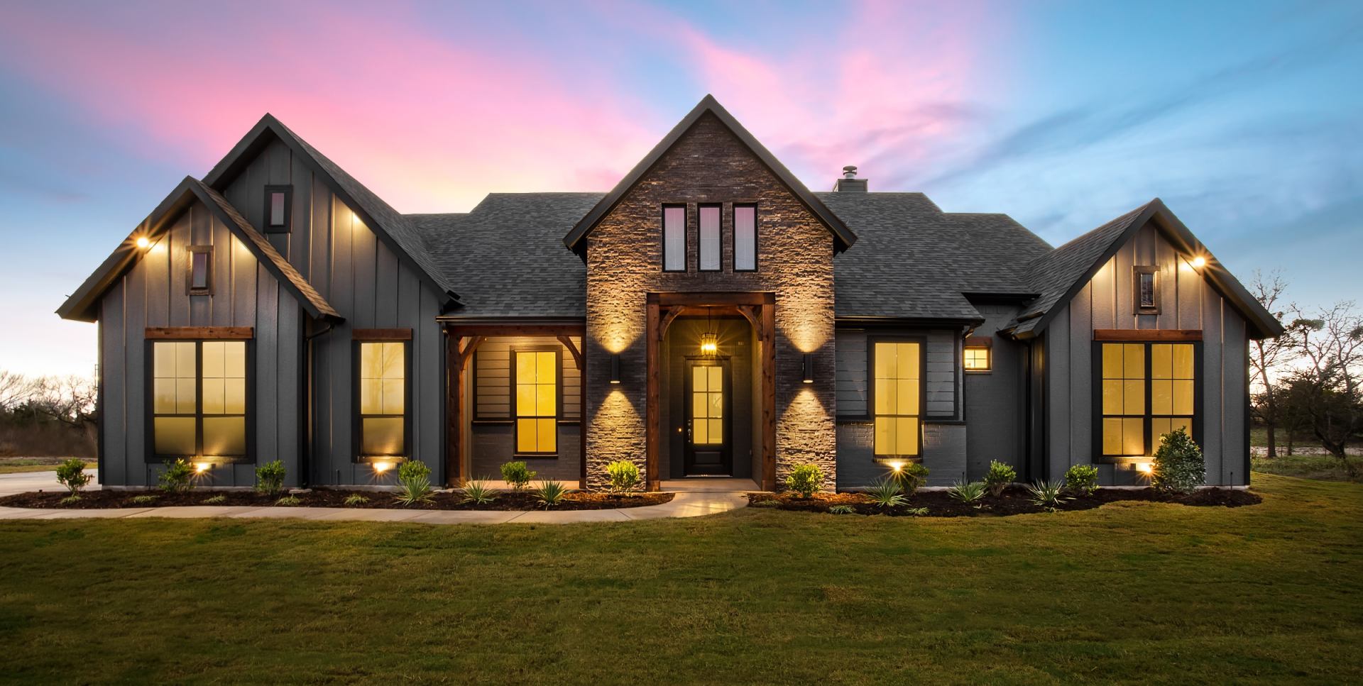 Twilight real estate photograph of a Jacksonville home with warm interior lighting at dusk